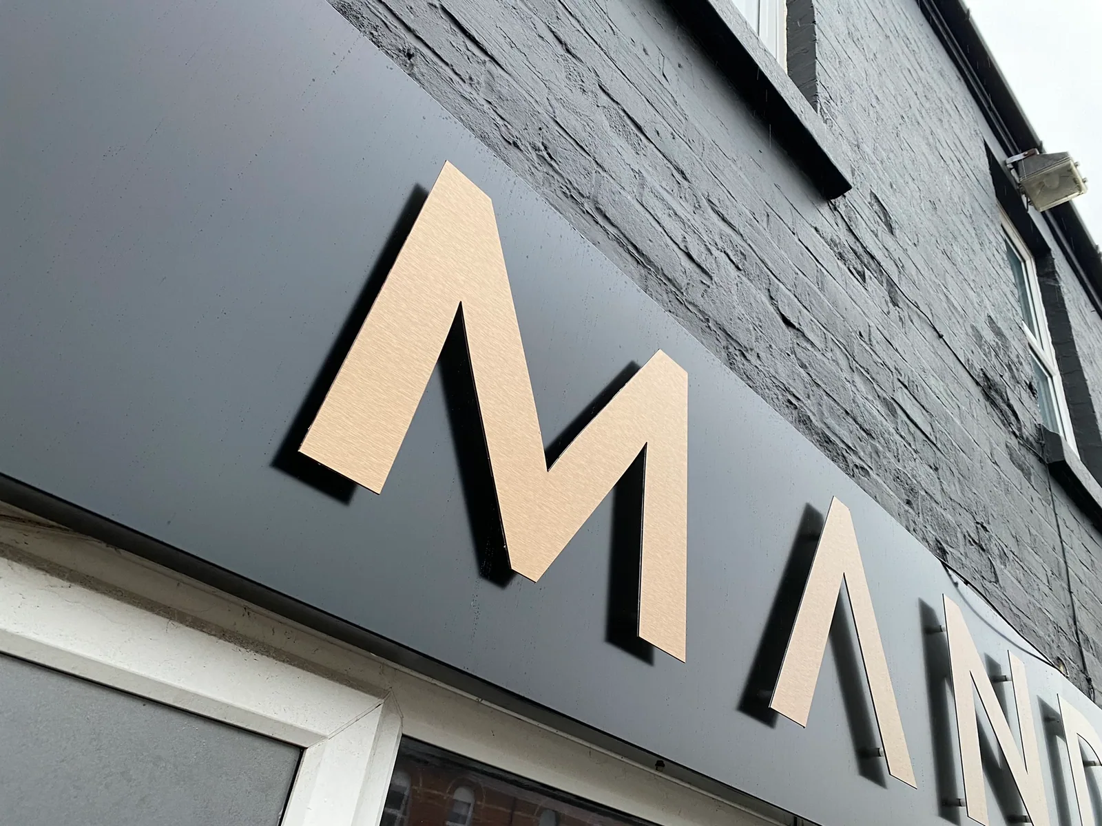 Flat cut lettering on the Mandala shop fascia