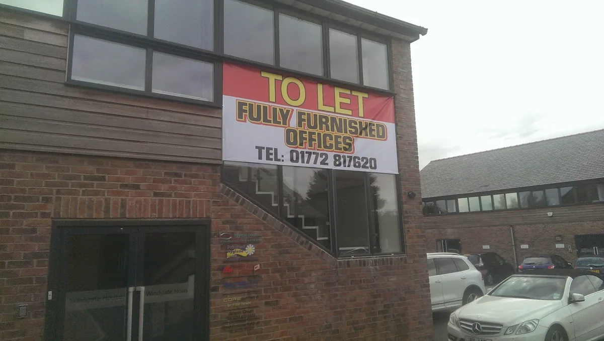 To Let banner fixed to the front of a building