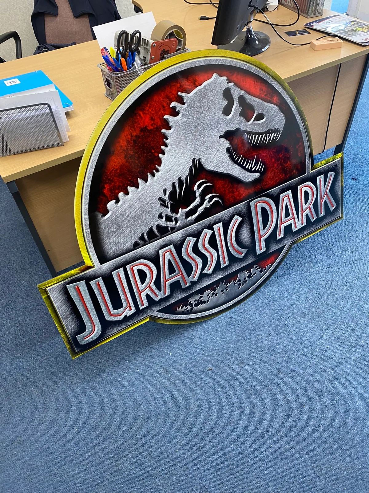 Contour-cut printed Jurassic Park logo panel