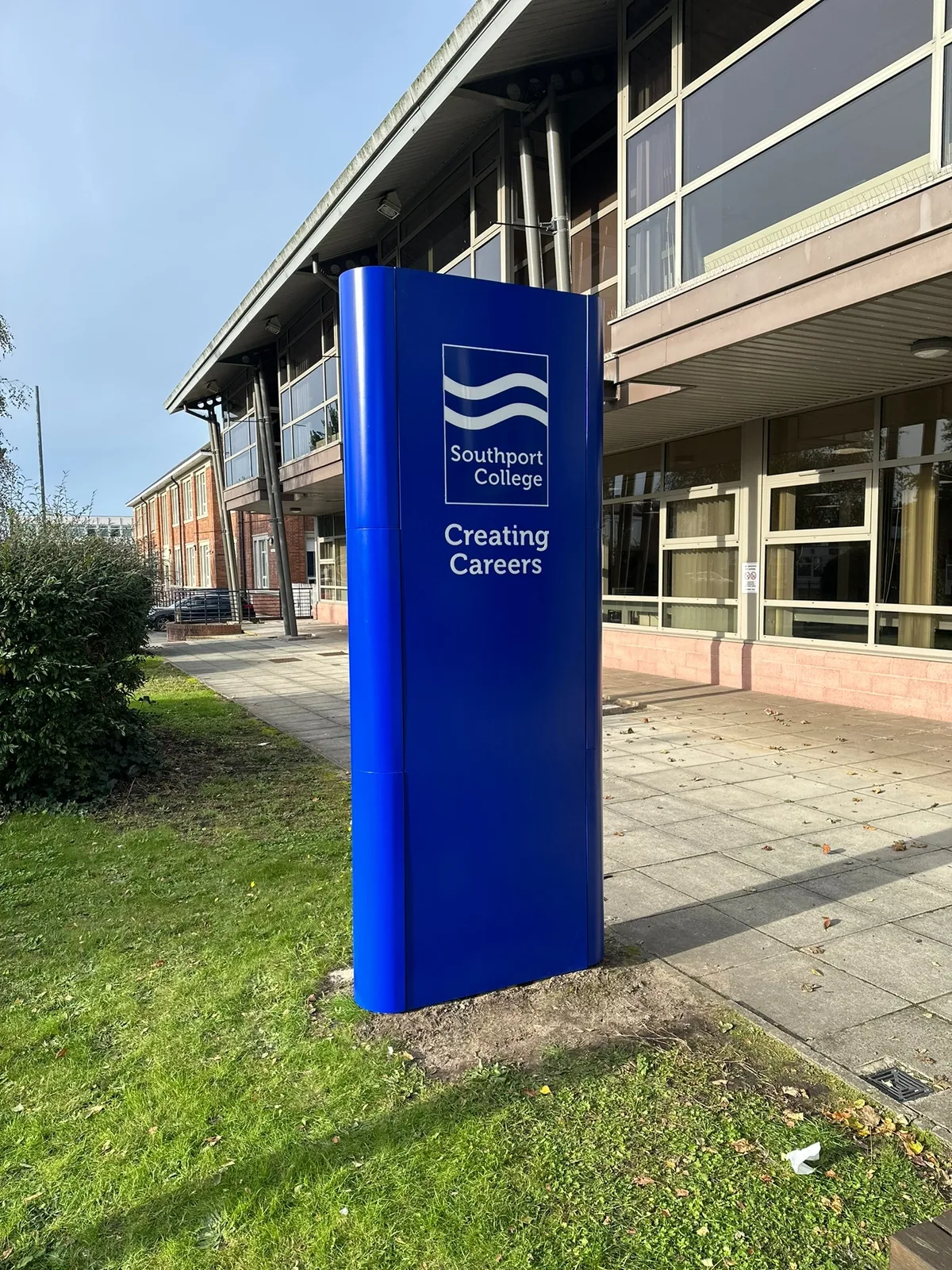 Blue Southport College freestanding totem sign