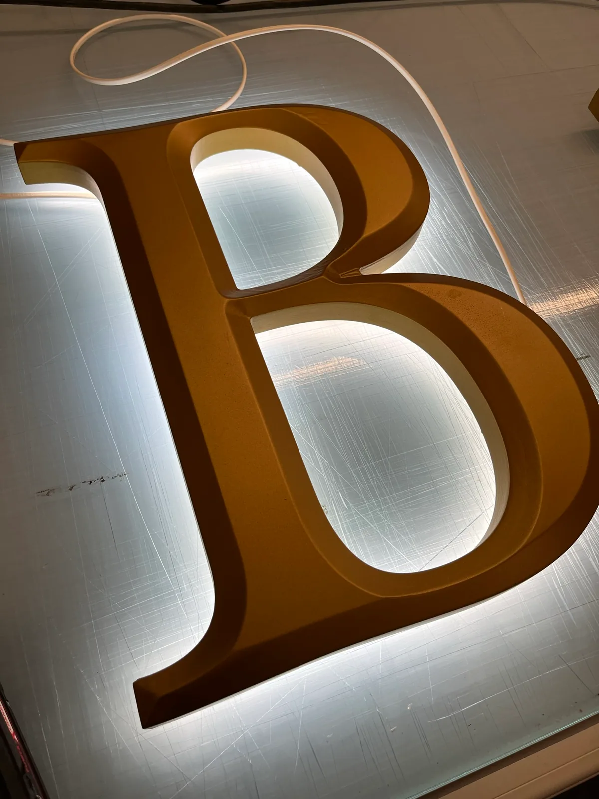 Halo-lit letter B with a reverse pocket for LEDs