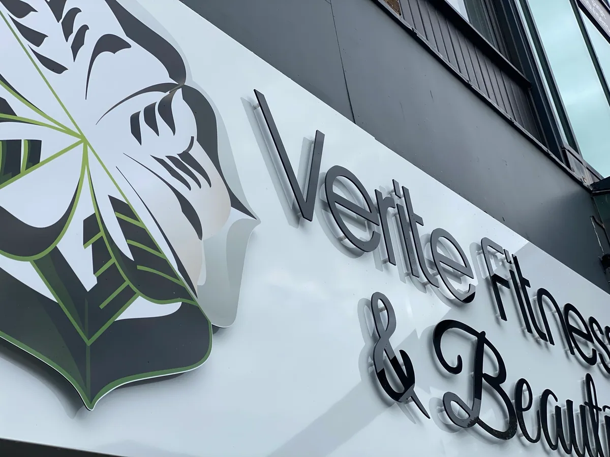 Grey dimensional lettering on a white shop fascia