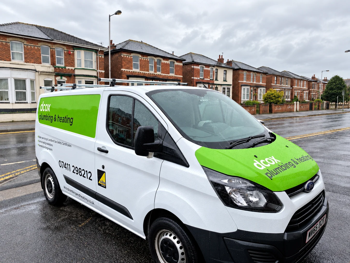 Acox Plumbing and Heating van with green vinyl graphics