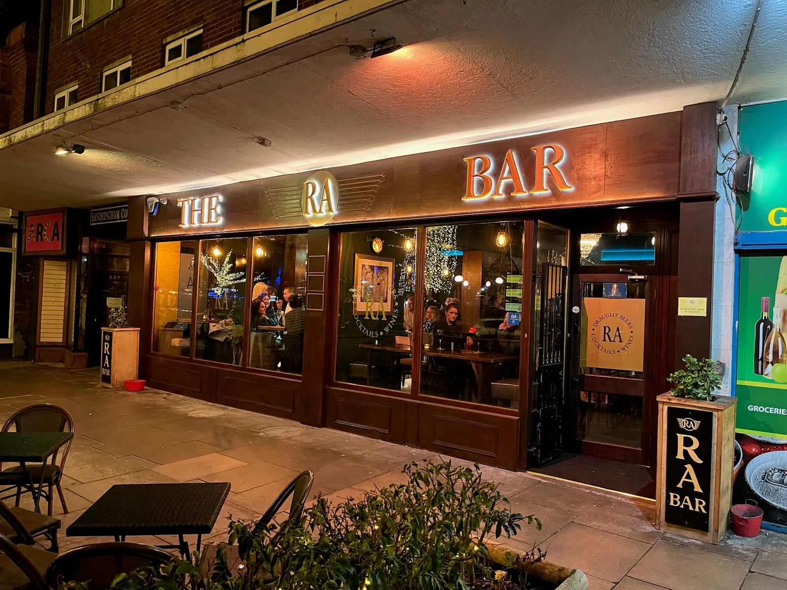 RA Bar — completed frontage. The completed frontage shows the painted faces of the routed Foamex letters, with white illumination around the lettering.