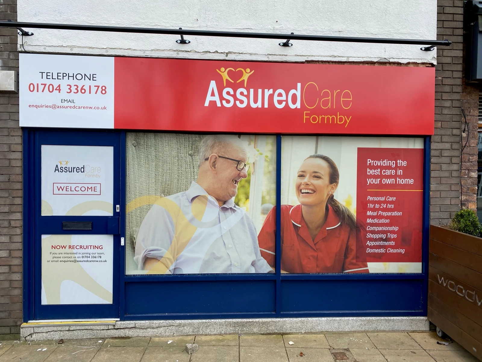 Assured Care Formby red sign tray and full-colour window graphics with service information