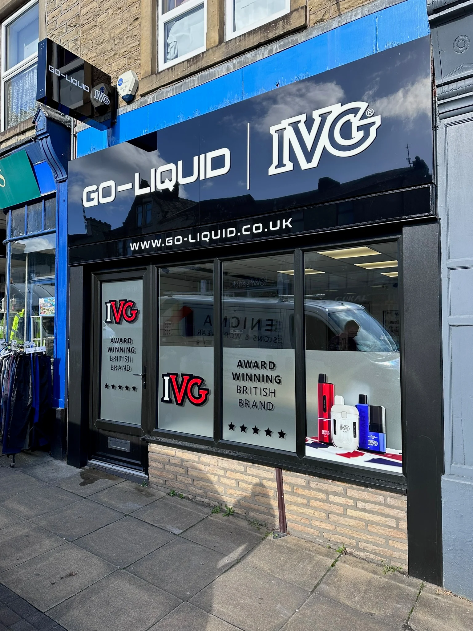 Close view of IVG logos, product photographs and wording on shop windows