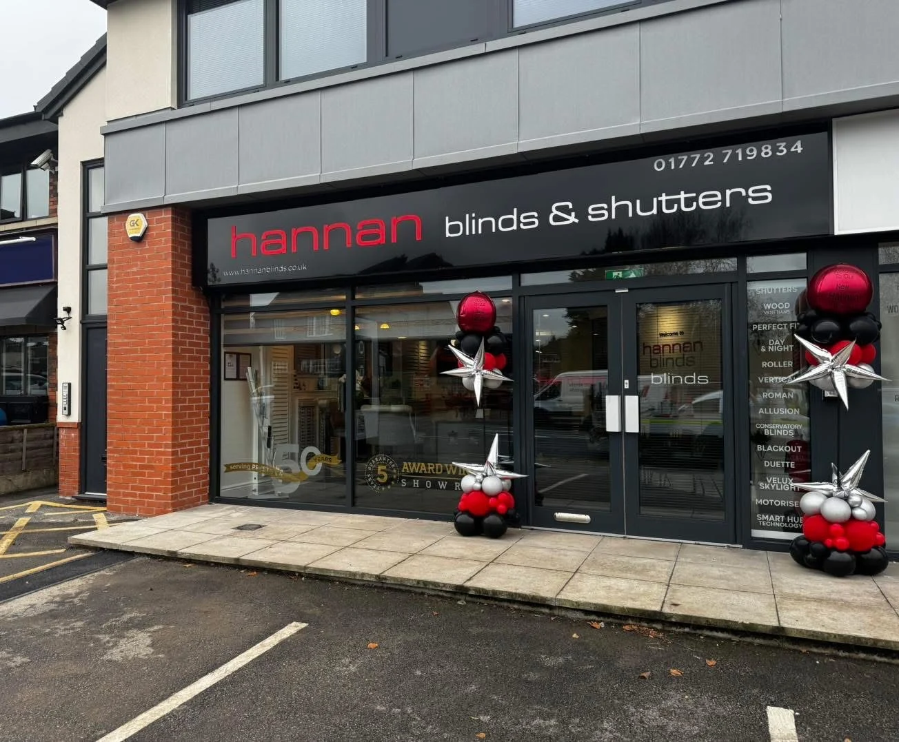 Hannan Blinds and Shutters fascia, window lettering and entrance in daylight