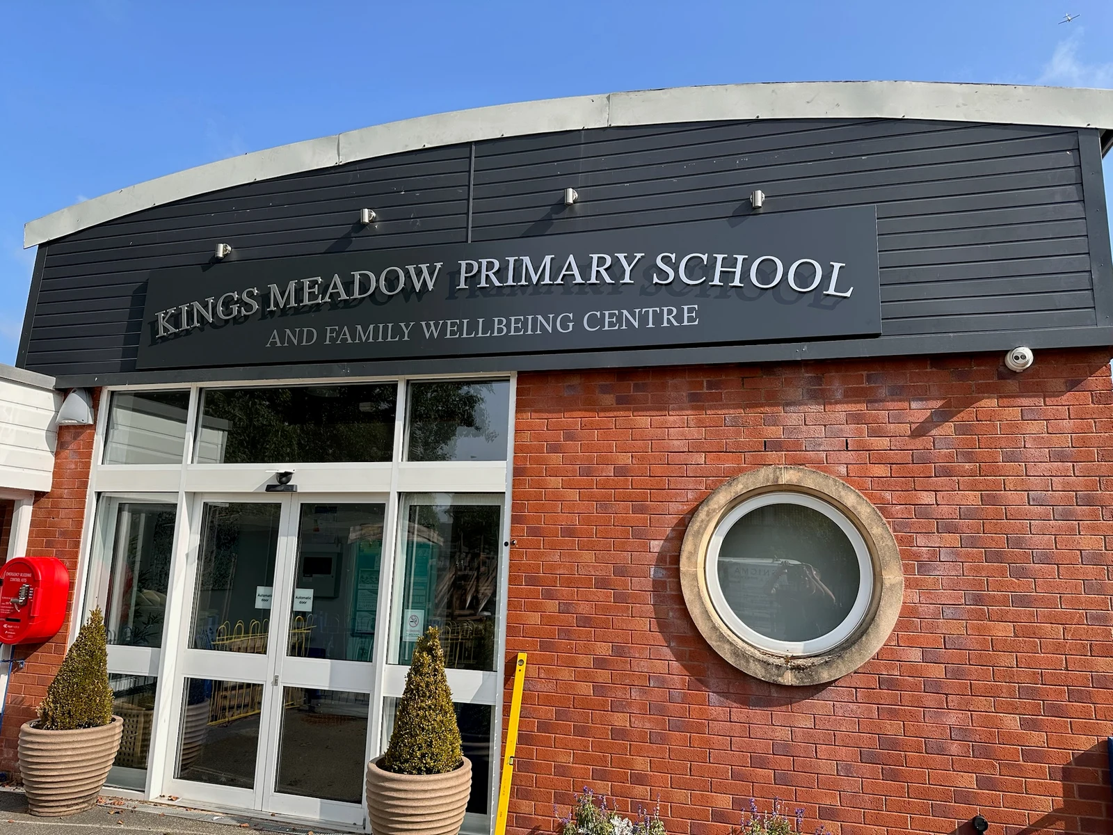 Kings Meadow Primary School and Family Wellbeing Centre lettering on a dark fascia