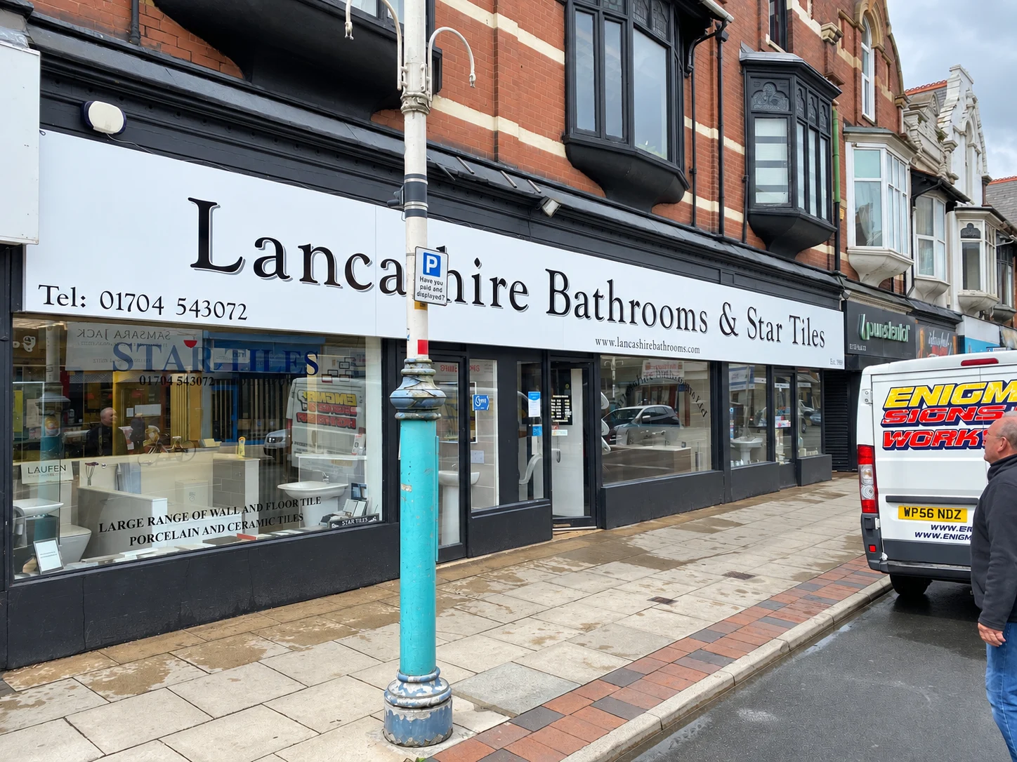 Lancashire Bathrooms and Star Tiles white sign tray with black vinyl lettering after replacement