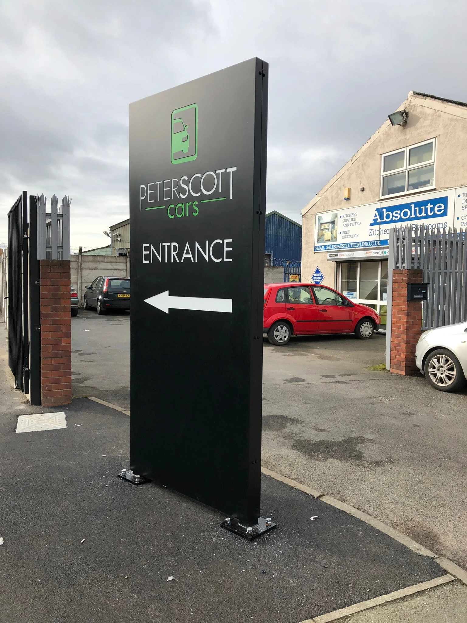 Peterscott Cars freestanding entrance totem with a directional arrow
